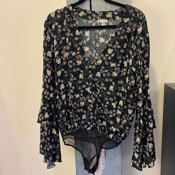 Free People Tops - Free People bodysuit with sheer lace snap closure thong. Beautiful flowy sleeves